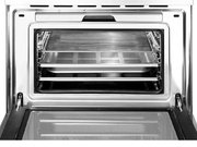 Компактный духовой шкаф с пароваркой Smeg SF4750VCBS фото 3 в Екатеринбурге